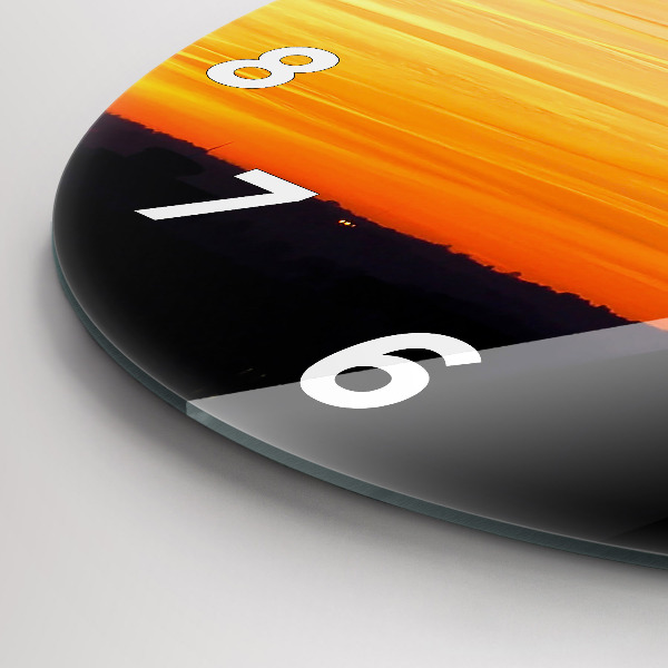 Okrúhle hodiny Budova a západ slnka